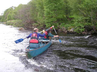 Learning to break out - canoeing skills above Spey Bridge, Newton More.